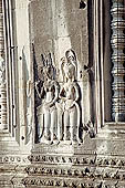 Angkor Wat temple, second enclosure, devatas sculpted in bas-relief with an extraordinary variety of intricate hair styles and costumes.